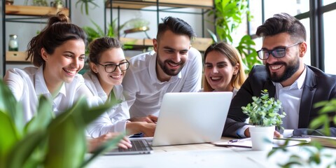 Group of people having a meeting in a bright, plant-filled office space, emphasizing a healthy and collaborative work environment.