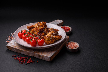 Delicious crispy grilled wings with teriyaki sauce with salt, spices