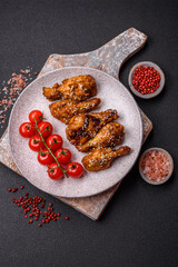 Delicious crispy grilled wings with teriyaki sauce with salt, spices