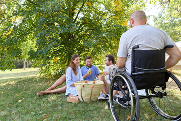 Inclusive picnic in the park with friends enjoying a beautiful day