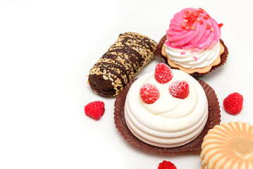 Delightful selection of pastries including a chocolate-covered treat with nuts, a meringue topped...