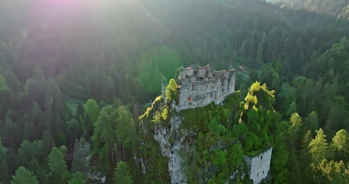 Aerial view of Castel belfort in Dolomite Alps, Italy. Collapsed walls of a castle on a rock in a mountain landscape. High quality 4k footage