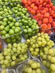 Grapes, peaches and cherry plums on the market