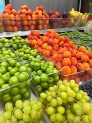 Grapes, peaches and cherry plums on the market