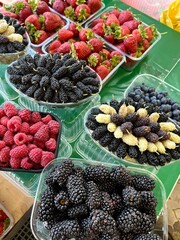Raspberries, strawberries and mulberries on the market