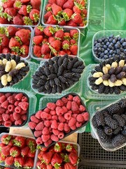 Raspberries, strawberries and mulberries on the market