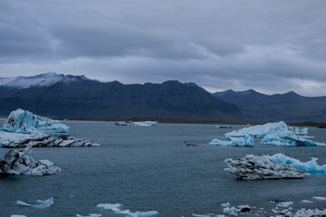 Jökulsárlón glacial lagoon. Sightseeing in Iceland in autumn, glacial icebergs in a lagoon with...