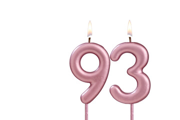 Lit birthday candle - Candle number 93 on white background