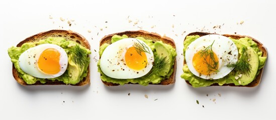 Avocado toast with hard-boiled eggs on a white background, perfect for a healthy breakfast, with copy space image.