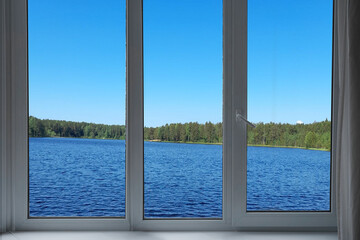  View from the window, green trees, landscape with lake.   