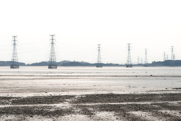 View of the power transmission towers on the sea