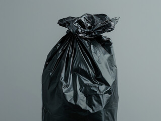 black garbage bag on grey background