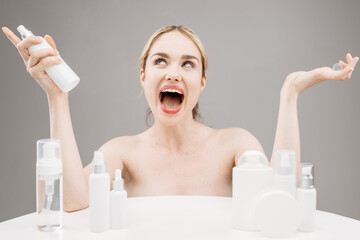 Cosmetics based on natural ingredients, scrub, tonic, body care. Sensual blonde woman on a light...