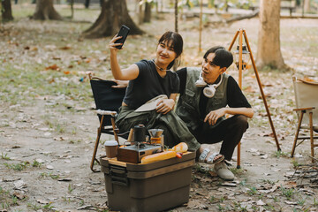 Asian couple sweet in tent inside on they camping trip, traveller relax and sleep togather in out door and camping trip