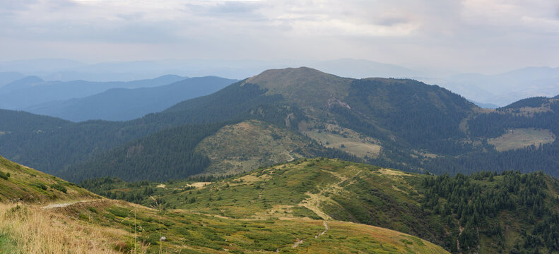 A panorama of the mountain landscape on a cloudy day. Early autumn in the Carpathian Mountains