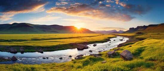 Fototapeta premium Experience the awe-inspiring beauty of the summer steppe and the majestic river originating from the mountains during a summer outdoor adventure with a captivating copy space image.