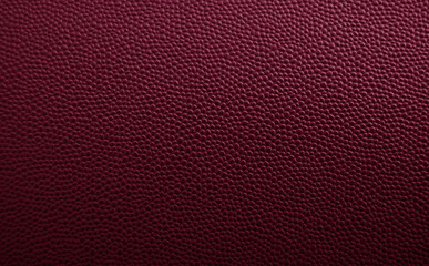 Maroon pebbled leather pattern as texture or background