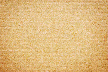 A sheet of brown corrugated cardboard texture as background