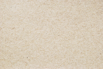 A sheet of beige recycled cardboard texture as background