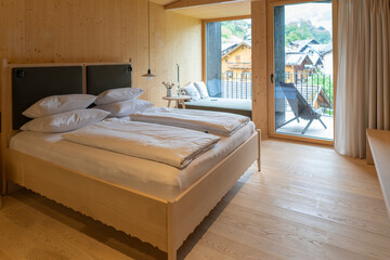 nice room in modern alpine hotel in Austria, wooden building with wall, floor and interior, made in fir wood and beautiful details, amazing feeling for holiday 