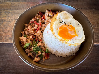 Minced pork with basil and fried egg on steamed rice.