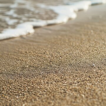 Close Up of Sand and Water on a Beach