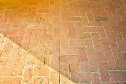 Typical old tuscany terracotta floors called a herringbone pattern due to its particular shape - Italy