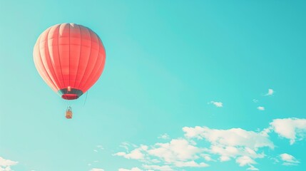 Obraz premium Serene red hot air balloon journey in a clear blue sky