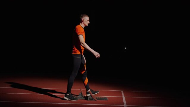 Professional Sportsman On Sprint Lane In Stadium, Runner Preparing To Start, Cardio Workout