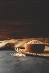 Wooden plate with sea salt and spices
