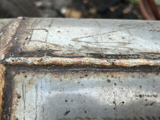 old rusty metal pipe , metal tube, welding steel