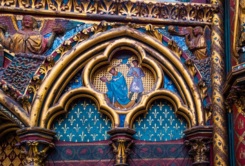 Obraz premium Detail of colorful paintings with saints and bas relief inside the Sainte Chapelle in Paris, Île-de-France, France.