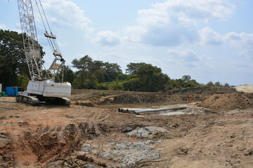 excavator on the site with sky