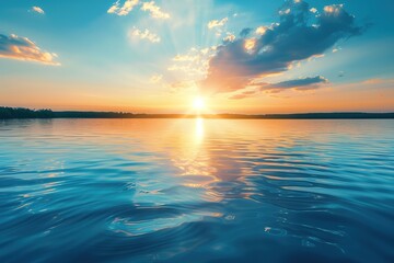 Obraz premium Beautiful calm lake with a blue sky and sunset