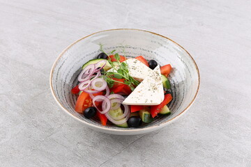 Salad with cheese and fresh vegetables isolated on white background. Greek salad.