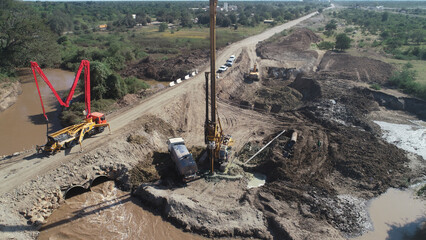 hydraulic  pile machine for drilling wells and installing piles at construction site