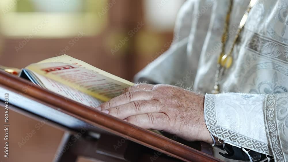 Canvas Prints Priest's hands with prayer books in the church at the service.