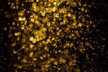 Blurred photo with golden dots visible glittering, shining brightly look and feel luxurious