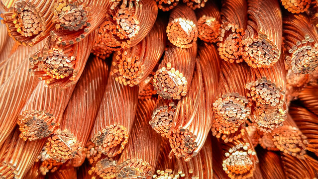 Detailed close-up of a heap of frayed and cut copper wires with visible strands and natural oxidation.