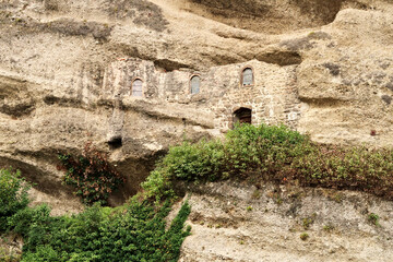 View onto the facade of the hidden Maximus Chapel, Cave, built into a cave in a cliff of the Mönchsberg, part of the Catacombs of Salzburg at the St. Peter*s Cemetery, Salzburg, Austria