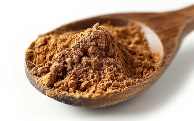 A bowl of brown sugar on a white surface.