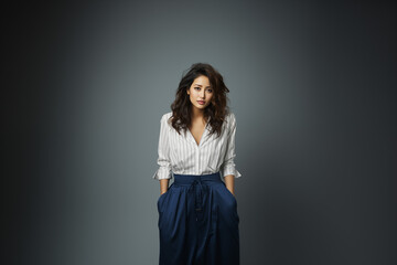 Fototapeta premium A Woman in Blue Outfit on Isolated Background