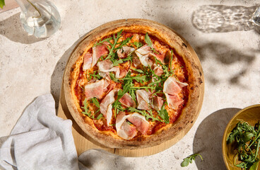 Pizza with Parma Ham and Arugula in Summer Sunlight and Shadows