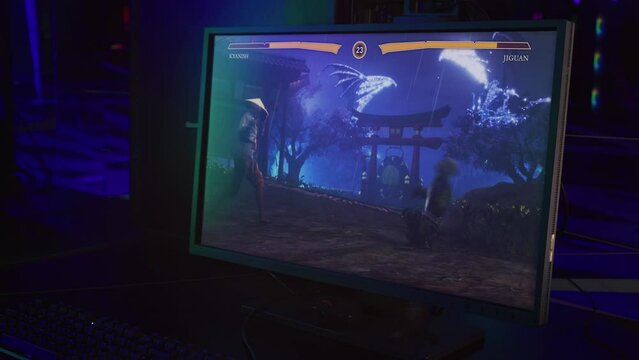 Heroes Fighting Vs Each Other In Martial Arts Battle On Modern Gaming PC. Ninja And Shaolin Monk Hero In Deadly Battle. PC Video Game. PC Screen Displaying Heroes In Battle. Animation