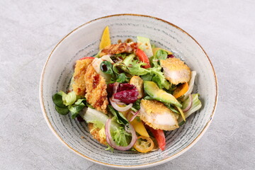 Salad with shrimps in panko breadcrumbs, top selling for restaurant and food delivery