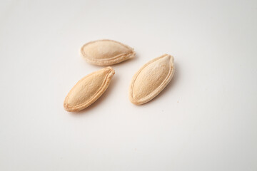 Pumpkin seeds on white background