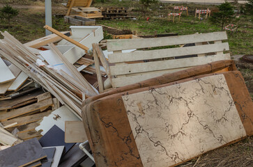 Garbage is lying in the city next to residential buildings