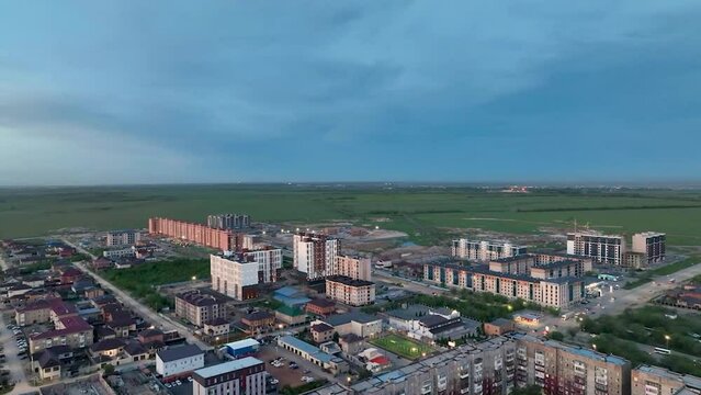video from a drone of a new district of the city of Karaganda, Kazakhstan, in the evening at sunset