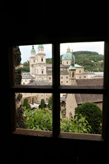 View onto the St. Peter's Cemetery from a window inside the Maximus Chapel, Maximuskapelle, built into a cave in a cliff of the Mönchsberg, part of the Catacombs of Salzburg, Salzburg, Austria