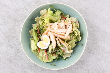 Salad with chicken breast and unagi sauce for the restaurant
